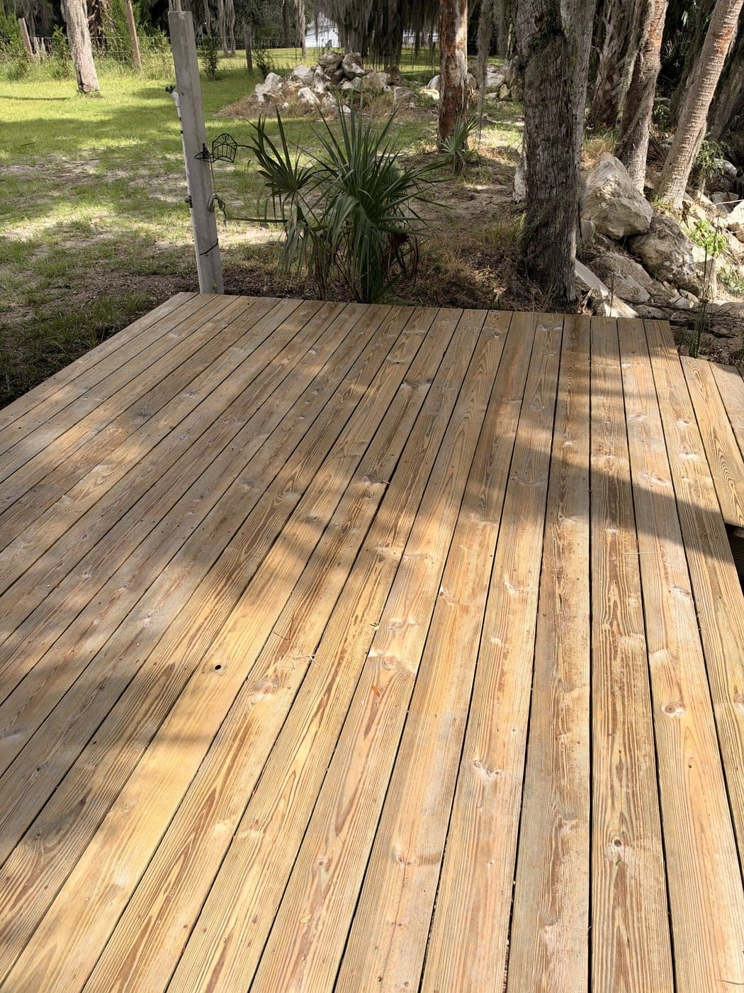 Bright, clean wood dock after cleaning
