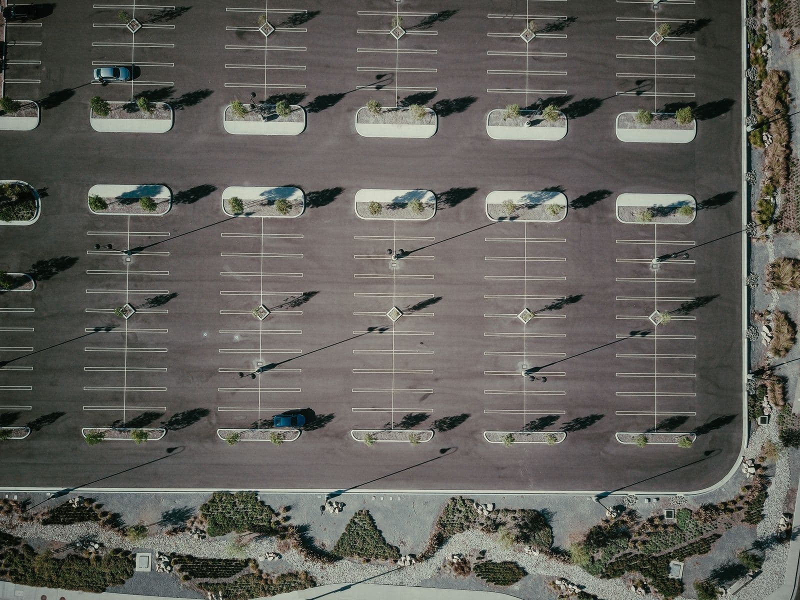 Aerial view of a clean, freshly striped commercial parking lot